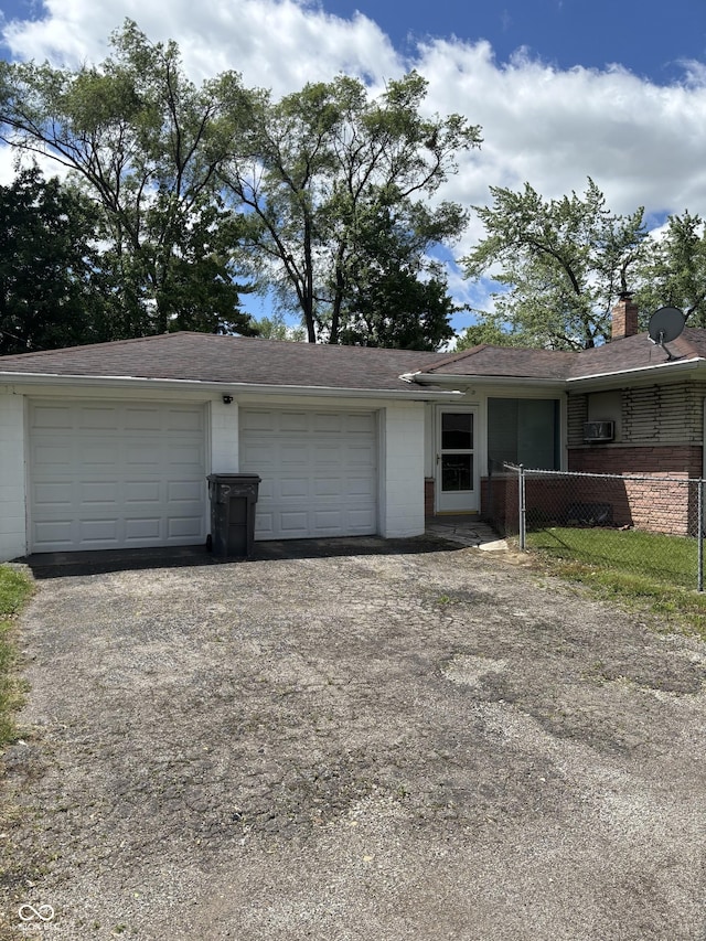 3031 W 18th St, Indianapolis, IN 46222 - view of front of house featuring a chimney, driveway, and brick siding