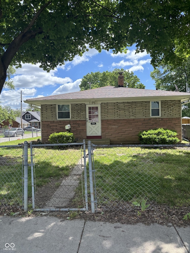 3031 W 18th St, Indianapolis, IN 46222 - ranch-style house featuring a chimney, a gate, and brick siding
