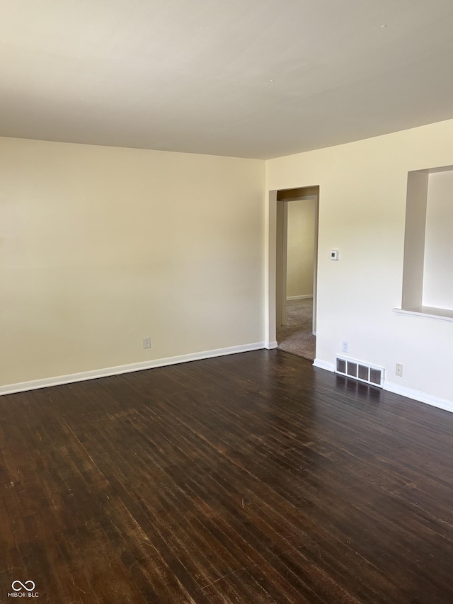 3031 W 18th St, Indianapolis, IN 46222 - empty room featuring dark wood-style floors and baseboards