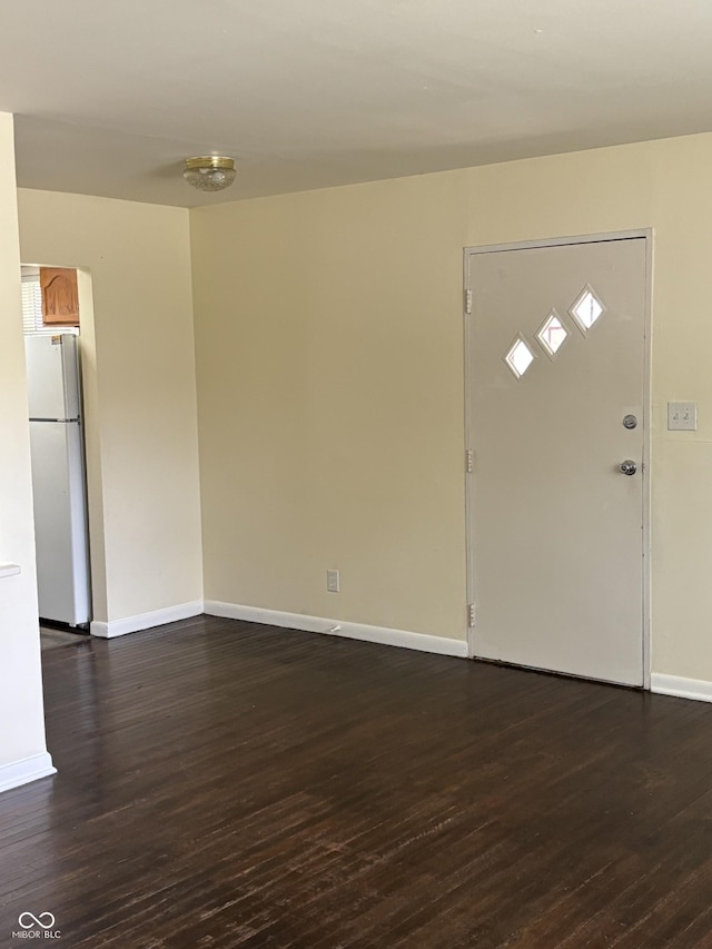 3031 W 18th St, Indianapolis, IN 46222 - foyer with dark wood-style floors and baseboards