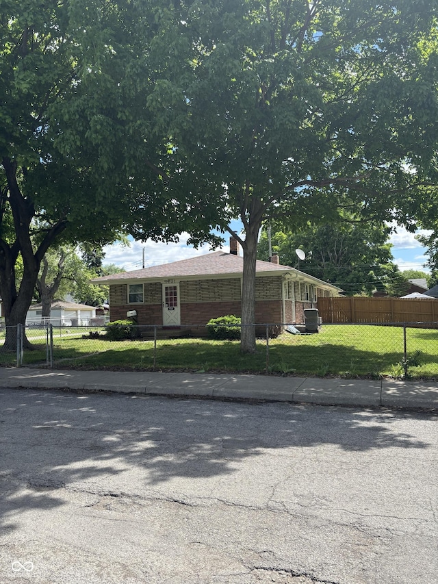 3031 W 18th St, Indianapolis, IN 46222 - view of front facade with brick siding and a chimney