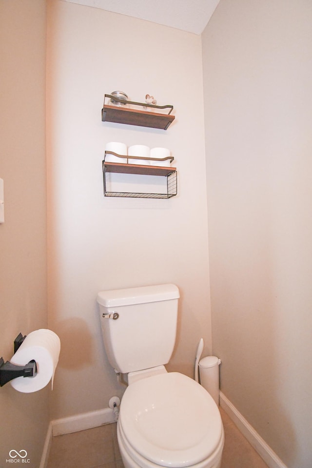 60 Bittersweet Ct, Seymour, IN 47274 - bathroom featuring baseboards, toilet, and tile patterned flooring
