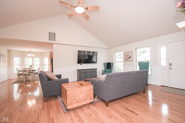 60 Bittersweet Ct, Seymour, IN 47274 - living area featuring high vaulted ceiling, light wood-style flooring, healthy amount of natural light, a chandelier, and ceiling fan