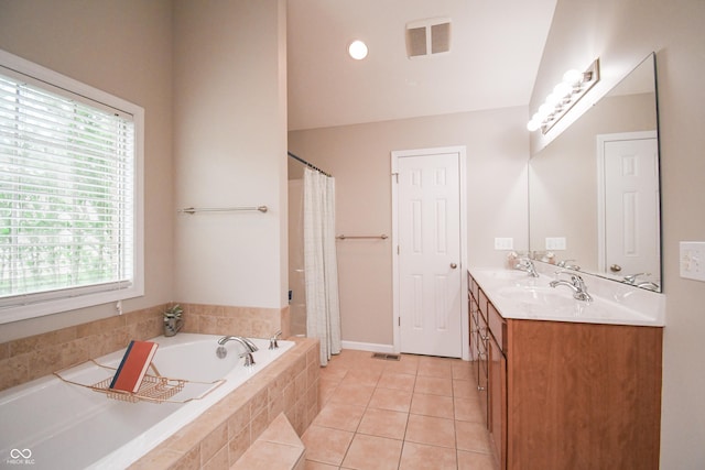 60 Bittersweet Ct, Seymour, IN 47274 - full bathroom featuring healthy amount of natural light, a garden tub, tile patterned floors, and double vanity