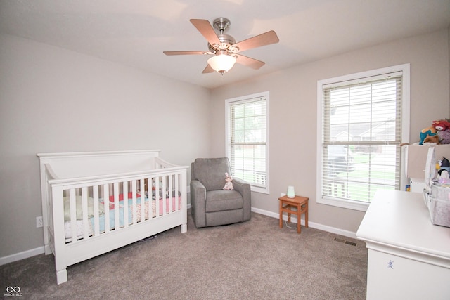 60 Bittersweet Ct, Seymour, IN 47274 - carpeted bedroom featuring baseboards, a nursery area, and a ceiling fan