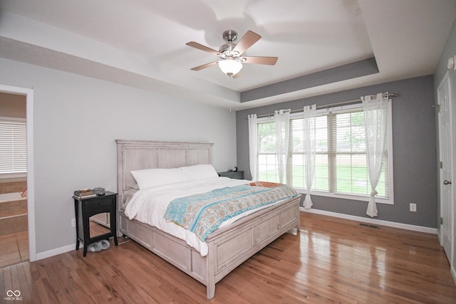 60 Bittersweet Ct, Seymour, IN 47274 - bedroom featuring a raised ceiling, baseboards, light wood-style floors, and ceiling fan