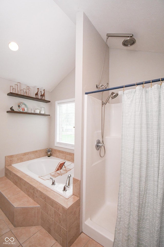 60 Bittersweet Ct, Seymour, IN 47274 - bathroom with curtained shower, vaulted ceiling, a garden tub, and tile patterned floors