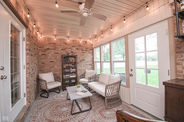 60 Bittersweet Ct, Seymour, IN 47274 - sunroom / solarium featuring track lighting, brick wall, and french doors