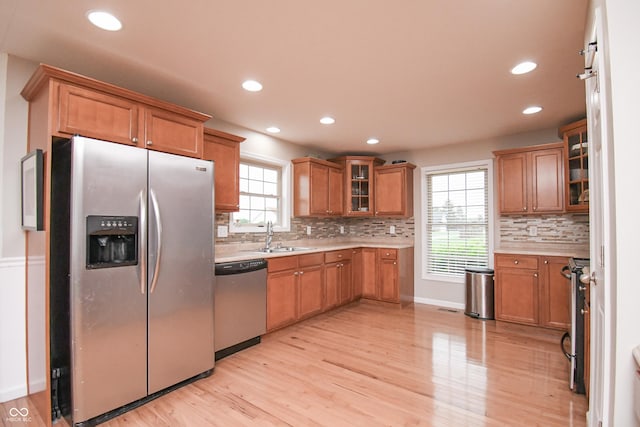 60 Bittersweet Ct, Seymour, IN 47274 - kitchen featuring appliances with stainless steel finishes, a sink, plenty of natural light, decorative backsplash, and recessed lighting
