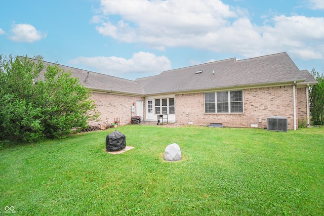 60 Bittersweet Ct, Seymour, IN 47274 - back of property featuring central AC unit, brick siding, and a yard