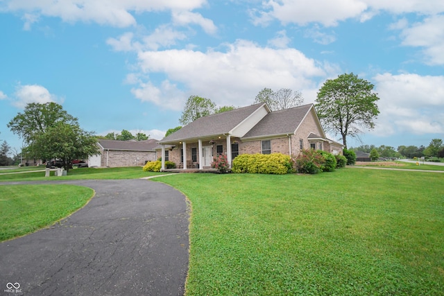 60 Bittersweet Ct, Seymour, IN 47274 - ranch-style home with a front lawn, a porch, and brick siding
