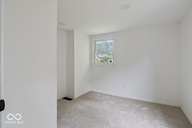 3218 N 24th St, Terre Haute, IN 47804 - spare room featuring light colored carpet and baseboards