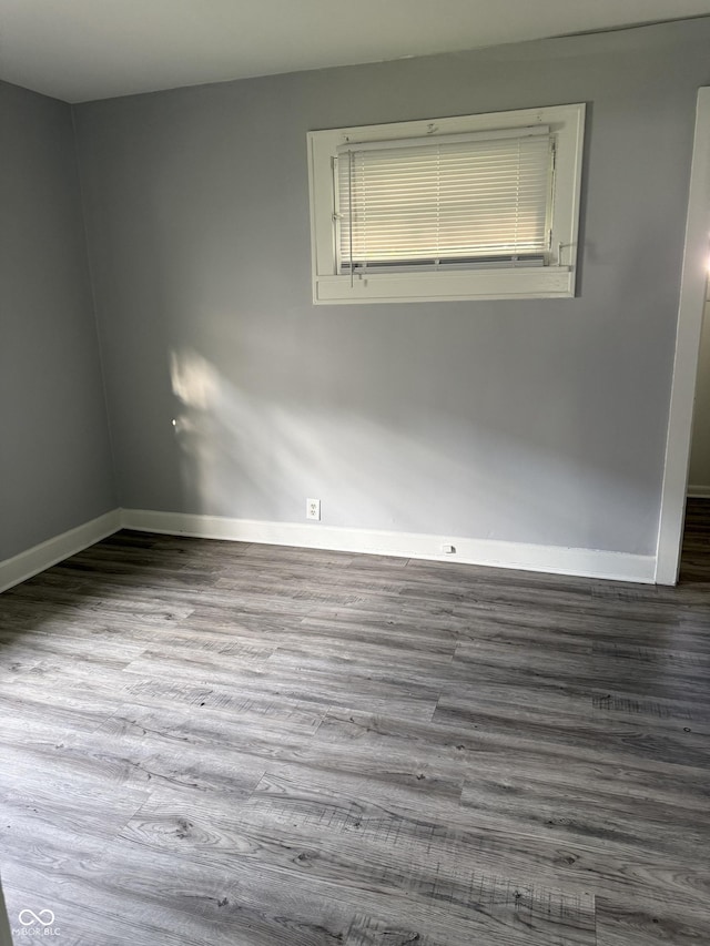 701 N Gladstone Ave, Indianapolis, IN 46201 - unfurnished room with baseboards and wood finished floors