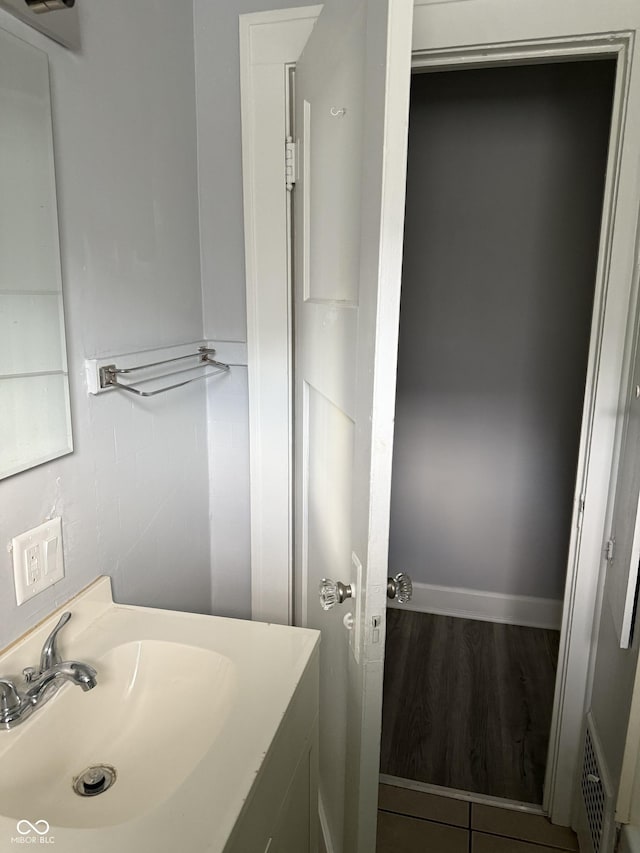 701 N Gladstone Ave, Indianapolis, IN 46201 - bathroom with vanity and wood finished floors