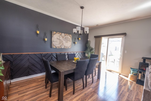 935 Northwich Ave, Westfield, IN 46074 - dining room with wood finished floors, a chandelier, wainscoting, ornamental molding, and baseboards