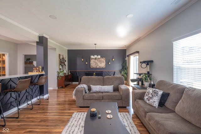 935 Northwich Ave, Westfield, IN 46074 - living area featuring a chandelier, crown molding, wood finished floors, and baseboards