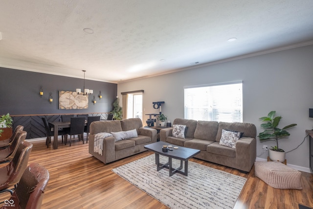 935 Northwich Ave, Westfield, IN 46074 - living area featuring a chandelier, ornamental molding, wood finished floors, and baseboards