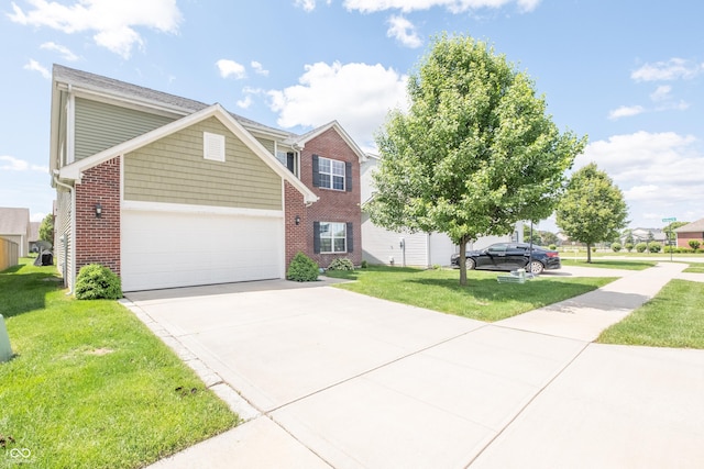 935 Northwich Ave, Westfield, IN 46074 - view of front of home featuring concrete driveway, brick siding, a front lawn, and an attached garage