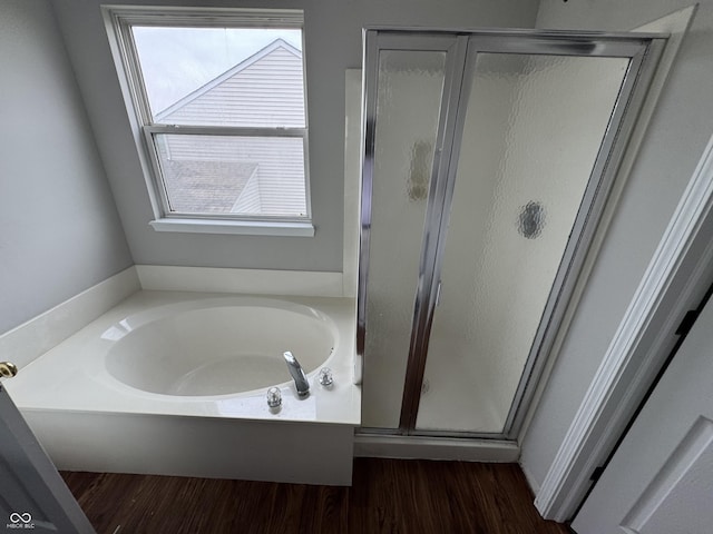 8939 Newchurch Blvd, Indianapolis, IN 46231 - full bathroom with a bath, a shower stall, and wood finished floors