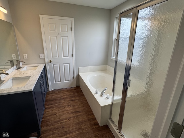 8939 Newchurch Blvd, Indianapolis, IN 46231 - full bath with wood finished floors, a bath, a stall shower, and double vanity