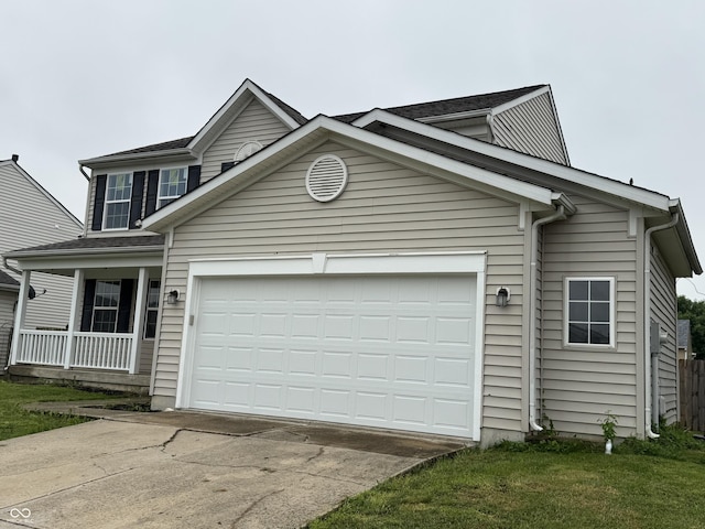 8939 Newchurch Blvd, Indianapolis, IN 46231 - traditional-style house with concrete driveway, a garage, and covered porch