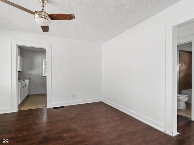 1209 W 22nd St, Anderson, IN 46016 - unfurnished room featuring a textured ceiling, wood finished floors, a ceiling fan, and baseboards