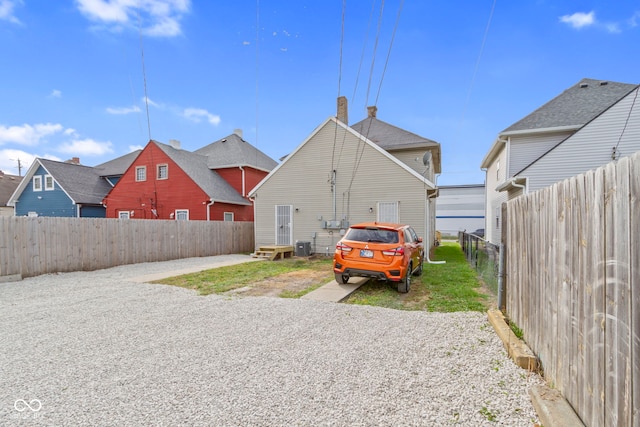 329 S State Ave, Indianapolis, IN 46201 - back of house with a fenced backyard and a patio