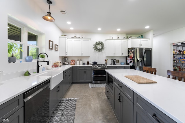 10104 E 850 S, Elizabethtown, IN 47232 - kitchen with stainless steel appliances, a sink, decorative light fixtures, light countertops, and recessed lighting