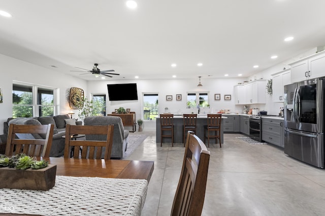 10104 E 850 S, Elizabethtown, IN 47232 - dining room with healthy amount of natural light, a ceiling fan, recessed lighting, and finished concrete flooring