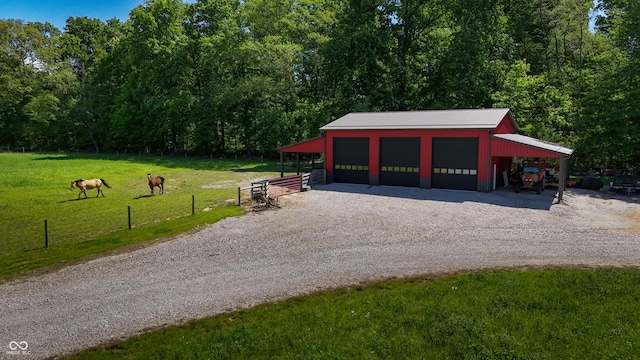 10104 E 850 S, Elizabethtown, IN 47232 - garage featuring a garage and gravel driveway