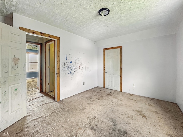 1947 N Parker Ave, Indianapolis, IN 46218 - carpeted empty room with a textured ceiling