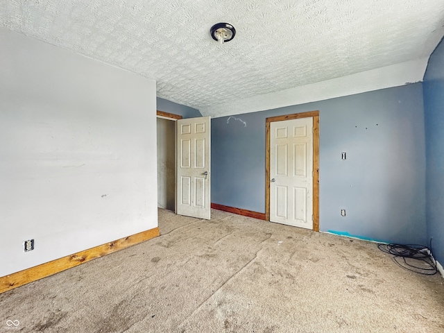 1947 N Parker Ave, Indianapolis, IN 46218 - unfurnished room featuring carpet flooring, a textured ceiling, and baseboards