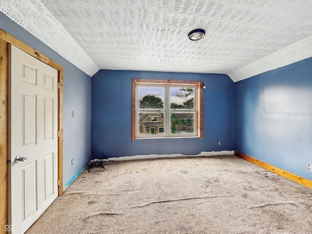 1947 N Parker Ave, Indianapolis, IN 46218 - carpeted empty room with vaulted ceiling and baseboards