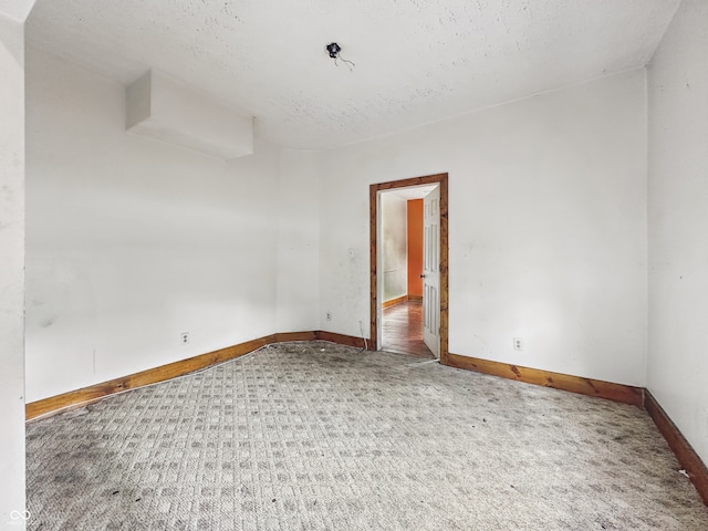 1947 N Parker Ave, Indianapolis, IN 46218 - spare room featuring carpet floors, baseboards, and a textured ceiling