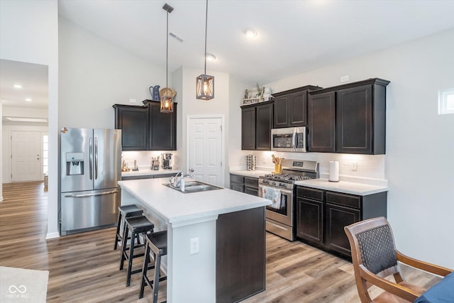 5304 Maywood Dr, Whitestown, IN 46075 - kitchen with stainless steel appliances, a sink, light countertops, decorative backsplash, and light wood-style floors