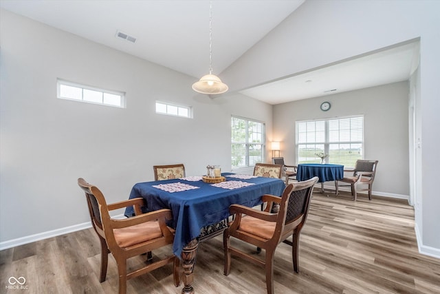5304 Maywood Dr, Whitestown, IN 46075 - dining space featuring light wood-style floors, baseboards, and high vaulted ceiling