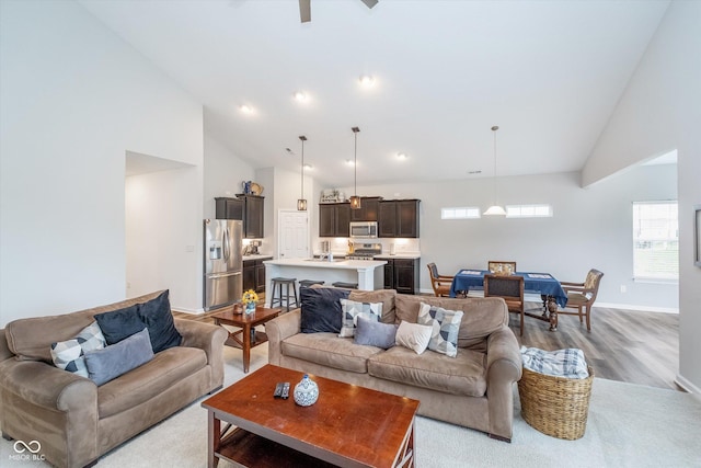 5304 Maywood Dr, Whitestown, IN 46075 - living area featuring high vaulted ceiling, light wood-style flooring, baseboards, and recessed lighting