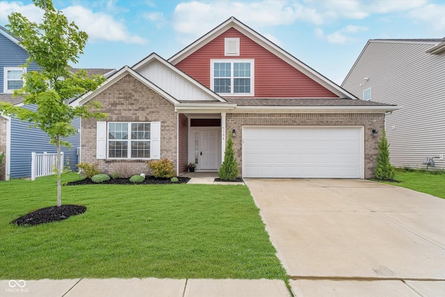 5304 Maywood Dr, Whitestown, IN 46075 - view of front of house featuring concrete driveway, a garage, brick siding, and a front lawn