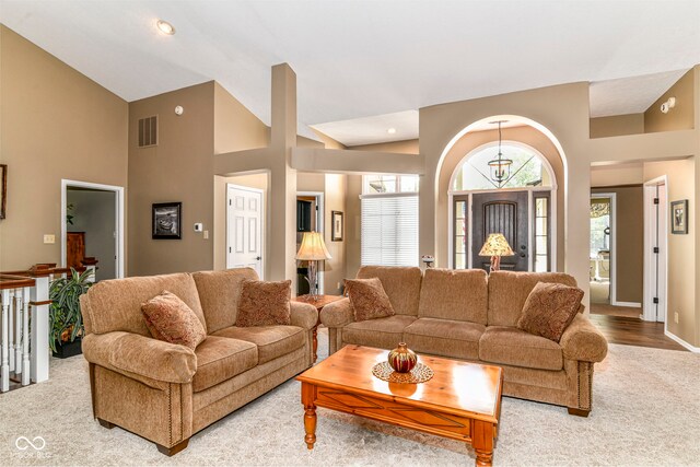 10759 Sawgrass Dr, Fishers, IN 46037 - living room with light colored carpet and high vaulted ceiling