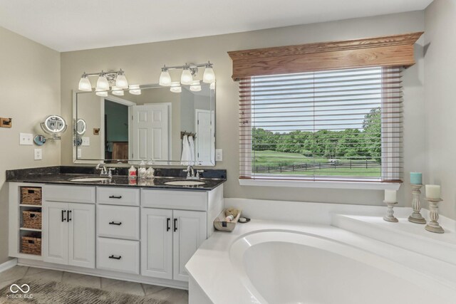 10759 Sawgrass Dr, Fishers, IN 46037 - bathroom featuring double vanity and a garden tub