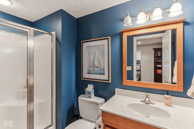 10759 Sawgrass Dr, Fishers, IN 46037 - full bath with a stall shower, vanity, and a textured ceiling