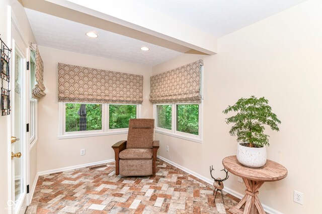10759 Sawgrass Dr, Fishers, IN 46037 - sitting room featuring brick flooring and recessed lighting