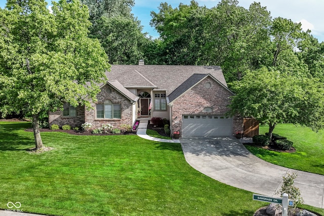10759 Sawgrass Dr, Fishers, IN 46037 - view of front of property featuring concrete driveway, a garage, a front yard, and brick siding