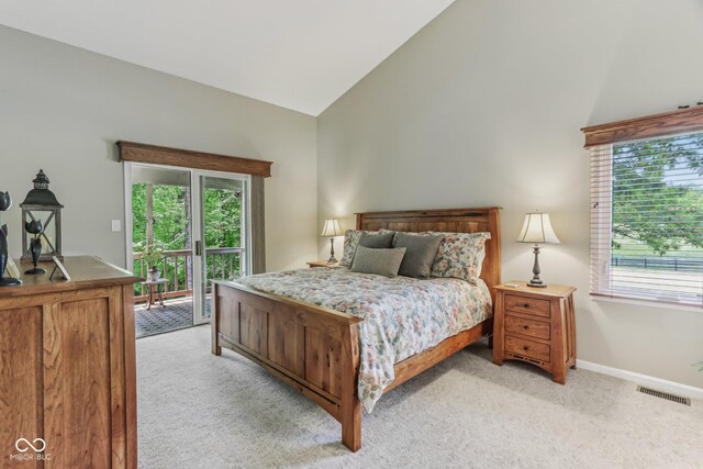 10759 Sawgrass Dr, Fishers, IN 46037 - bedroom featuring light colored carpet, access to exterior, and high vaulted ceiling