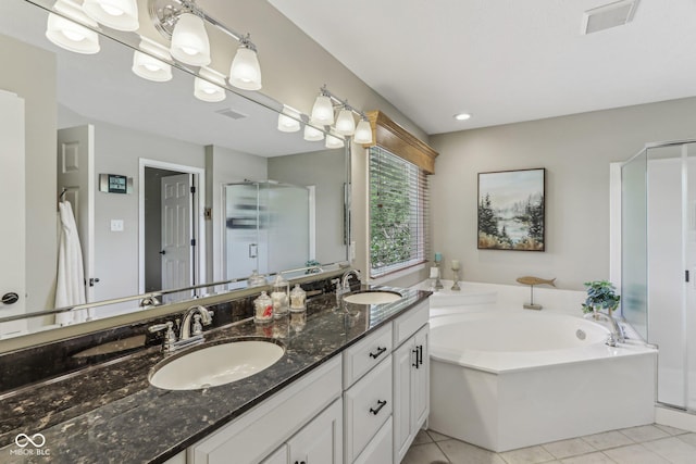 10759 Sawgrass Dr, Fishers, IN 46037 - bathroom featuring a stall shower, double vanity, a bath, and tile patterned floors