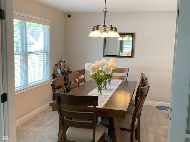 425 Bridgewater Ln S, Muncie, IN 47304 - dining area with healthy amount of natural light, a chandelier, and baseboards