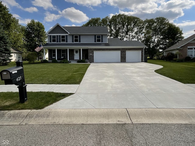 425 Bridgewater Ln S, Muncie, IN 47304 - colonial house featuring covered porch, driveway, a garage, and a front lawn