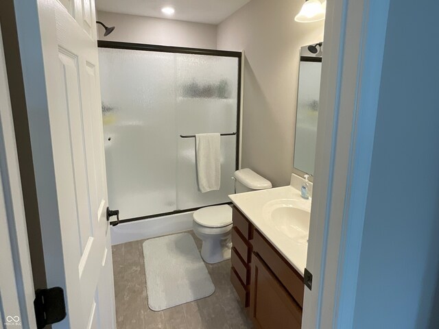 425 Bridgewater Ln S, Muncie, IN 47304 - bathroom with a stall shower, vanity, and toilet