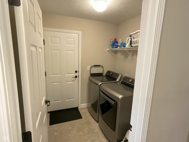 425 Bridgewater Ln S, Muncie, IN 47304 - laundry room featuring separate washer and dryer and a textured ceiling