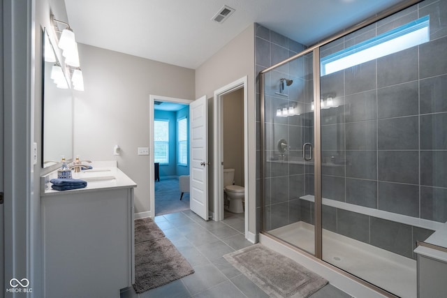 9741 Haughton Ln, Mccordsville, IN 46055 - full bathroom featuring vanity, plenty of natural light, a stall shower, and tile patterned floors